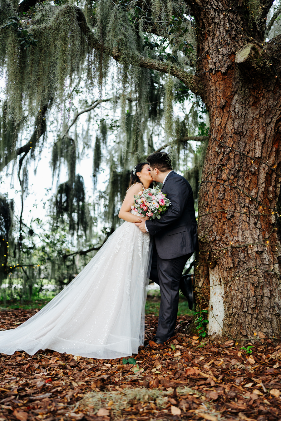 Romantic kiss between bride and groom at Ever After Farms Ranch